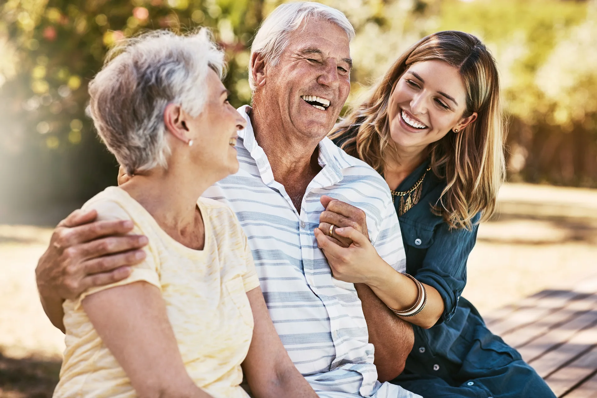 Happy patients enjoying healthy smiles with Gentle Dental flexible payment options